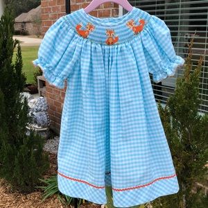 Smocked knee-length dress w/embroidered foxes